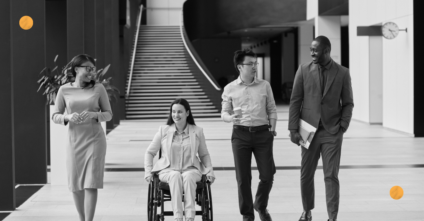 A person with a disability happily working together with a group of people.